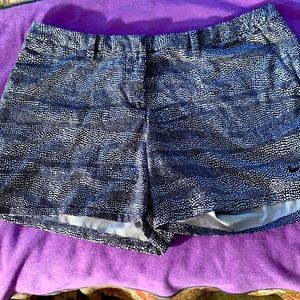 Women’s Nike size 12 golf shorts. Black and white print. Like new.